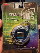 1998 Tiger Electronics Millennium 2000 Handheld Digital Mascot Game/Trivia RARE