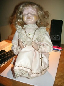 praying porcelain doll