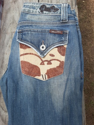 cow print on one back pocket 