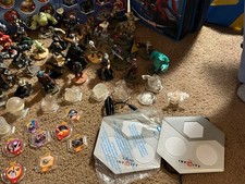 Disney Infinity Over 75 Pieces Figures, Discs and Carrying Case.