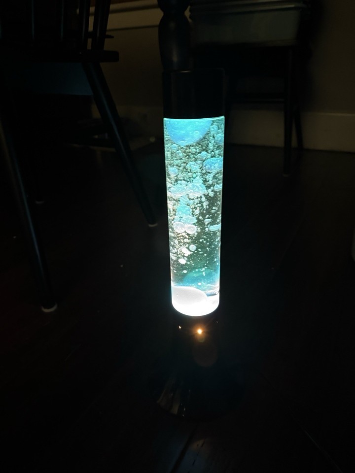 Genuine vintage 'Oozy Glo' lava lamp — the real deal, not a modern reissue, with that unmistakable blue liquid motion grooviness.