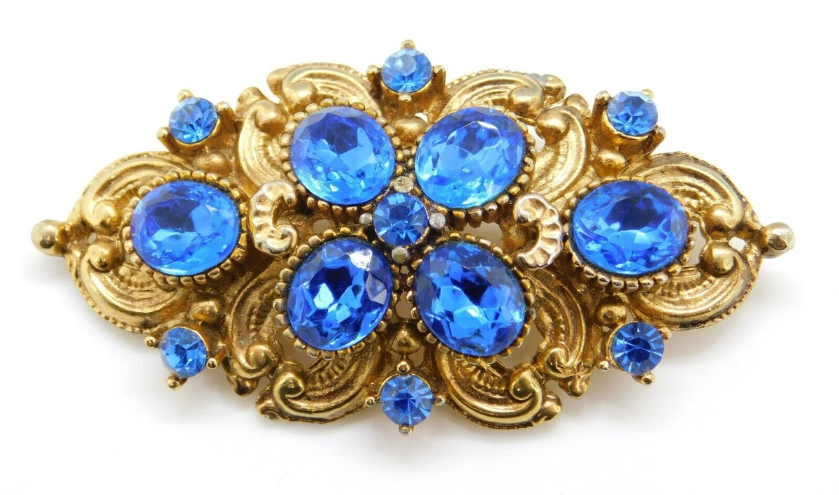 Blue stone brooch deals