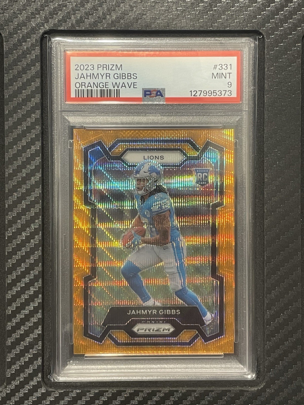 2023 PSA 9 Jahmyr Gibbs RC #331 Orange Wave Prizm #’d/60 Rookie Card Prizm NFL