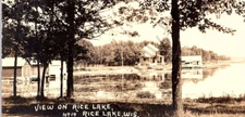 1908 RPPC Rice Lake, Wi. Lake View Of Cabins & House Rice Lake