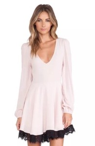 light pink fit and flare dress with sleeves