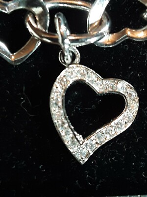8''  Heart bracelet with a 'silver heart charm', pre-owned