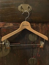 Vintage wooden hanger from the Plaza hotel in New York ciy.