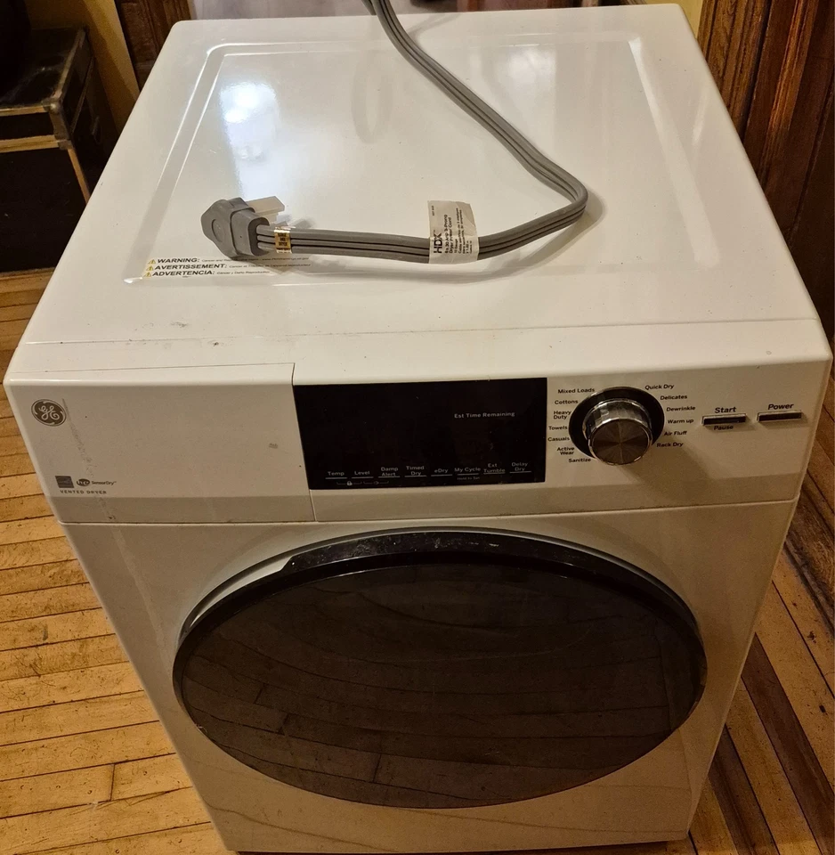 Secadora eléctrica apilable carga frontal ventilada GE GFD14ESSNWW 24" 4,3 pies cúbicos en blanco Foto 3 de 4