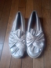 Unique Silver With A Bow Slip Ons Size 6