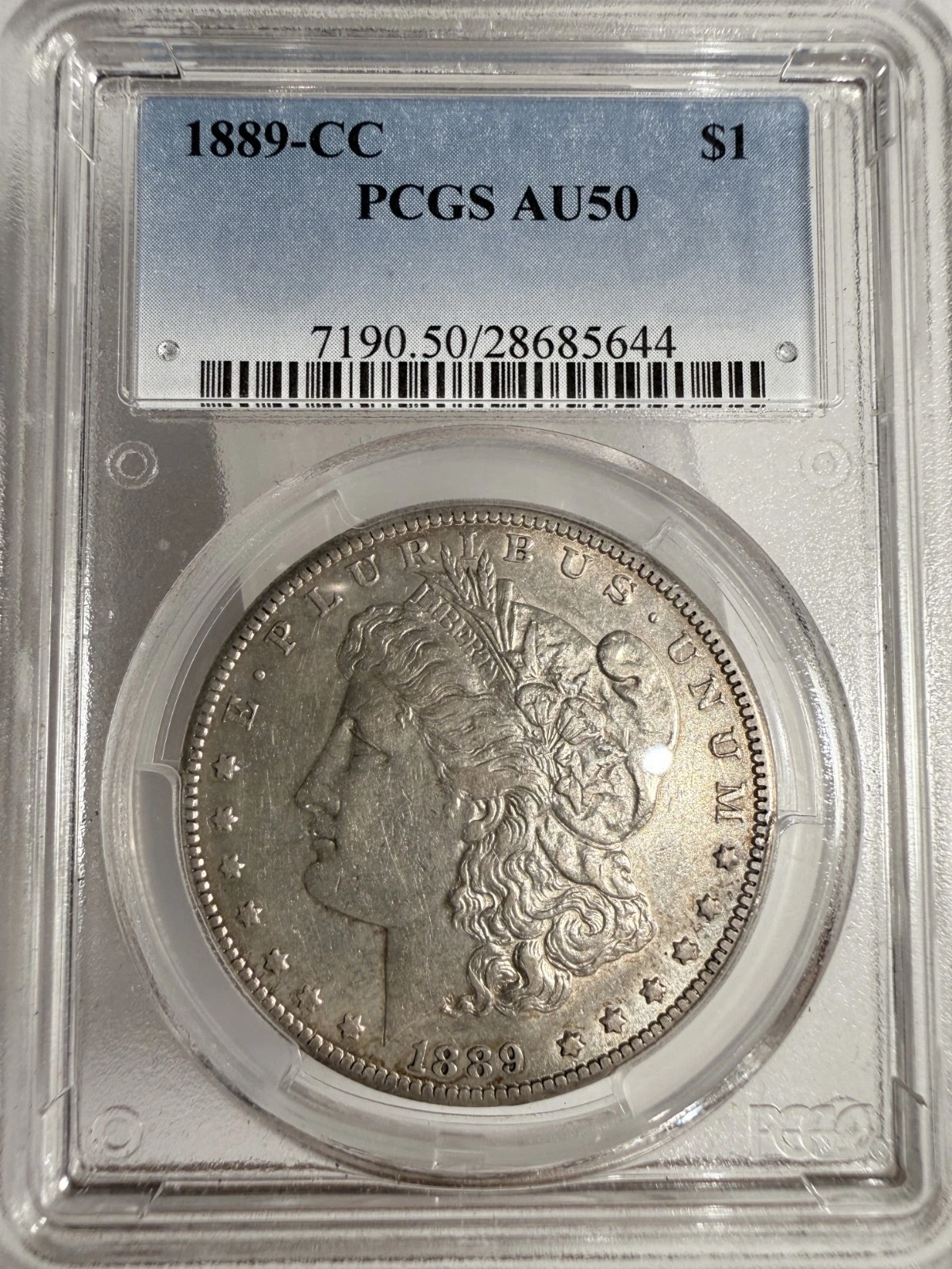 1889-CC Morgan Silver Dollar, AU50 PCGS. (13194)