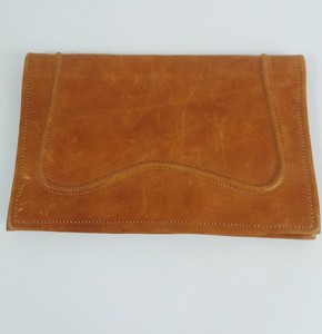 tan leather clutch
