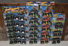 HUGE LOT OF HOTWHEELS SNAKEBITE MONSTER TRUCKS BIGFOOT