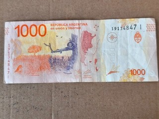 Argentina 1000 pesos risque déchirure pliure etc..