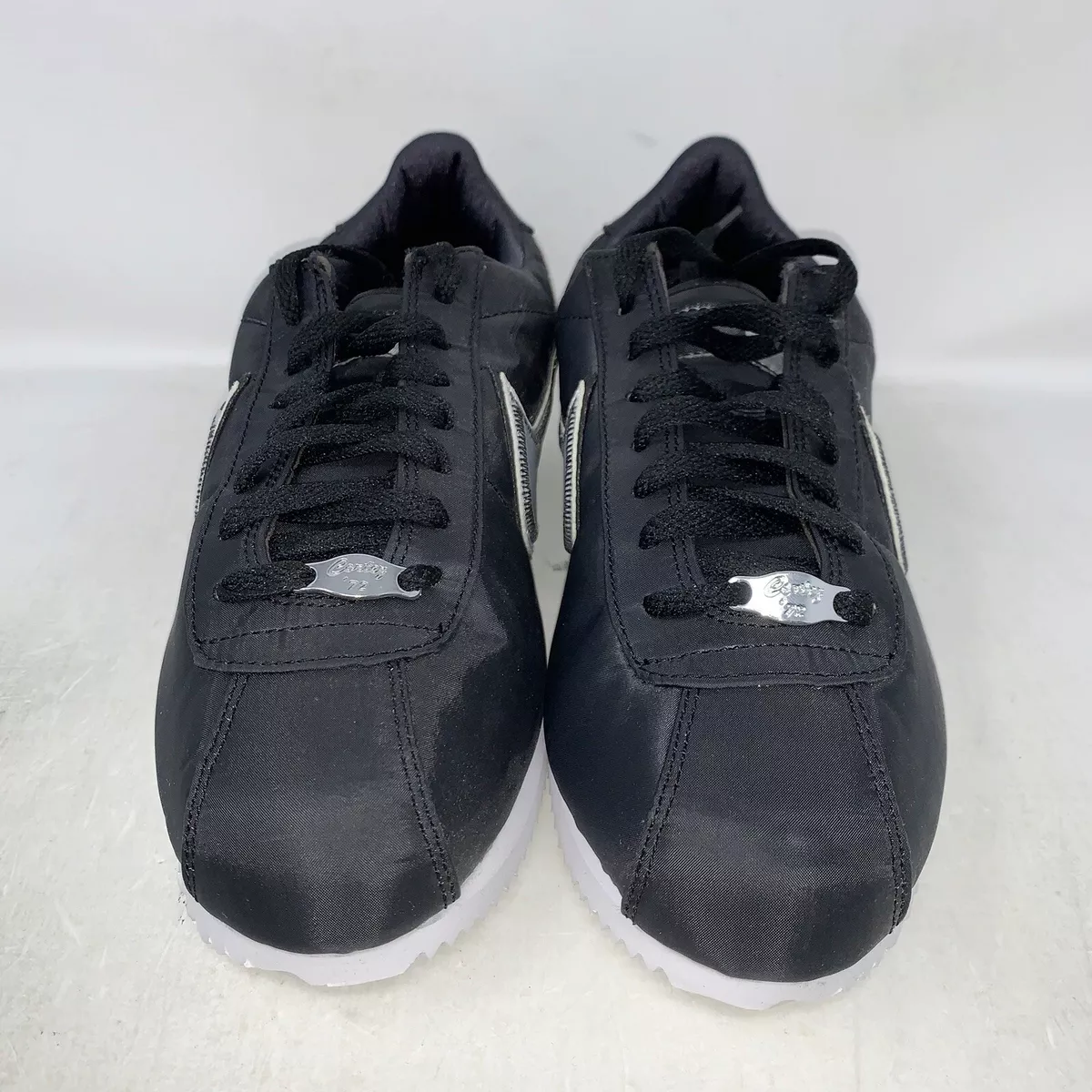 Gray and black nike cortez shop