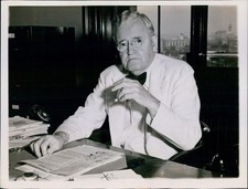 News White Suited Politician Enjoys Cigar In His Office Politics 7X9 Press Photo