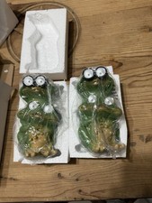 Two frog statue featuring integrated solar-powered LED lights for outdoor