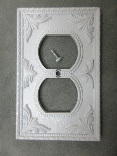 White Metal Electrical Wall Outlet Cover Plate Signed Buckler's Fifth Avenue NY