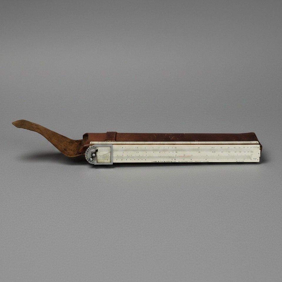 A 10-inch bamboo Hemmi Sun slide rule with leather case — Japanese-made from actual bamboo, patented, and gorgeous as both a tool and an art object.