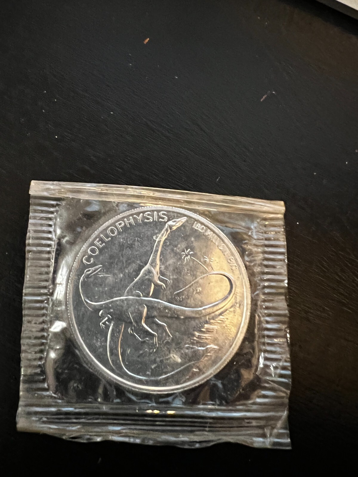 Post Cereal COELOPHYSIS Dinosaur Coin Token Toy WHEN THE WORLD WAS YOUNG MIP