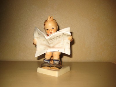hummel boy reading newspaper