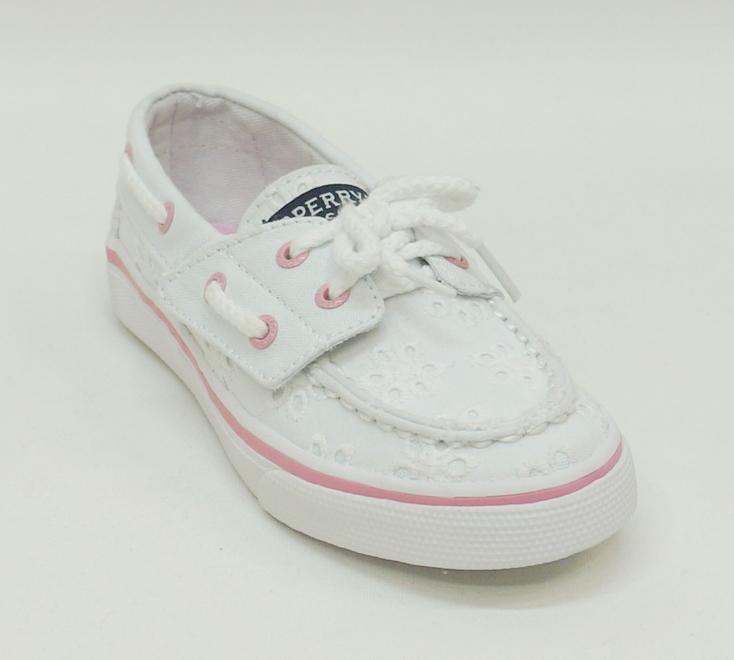 white slip on boat shoes