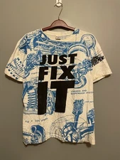 VTG Stanley Desantis T Shirt Mens 2XL Home Improvement "Just Fix It" AOP (C380)
