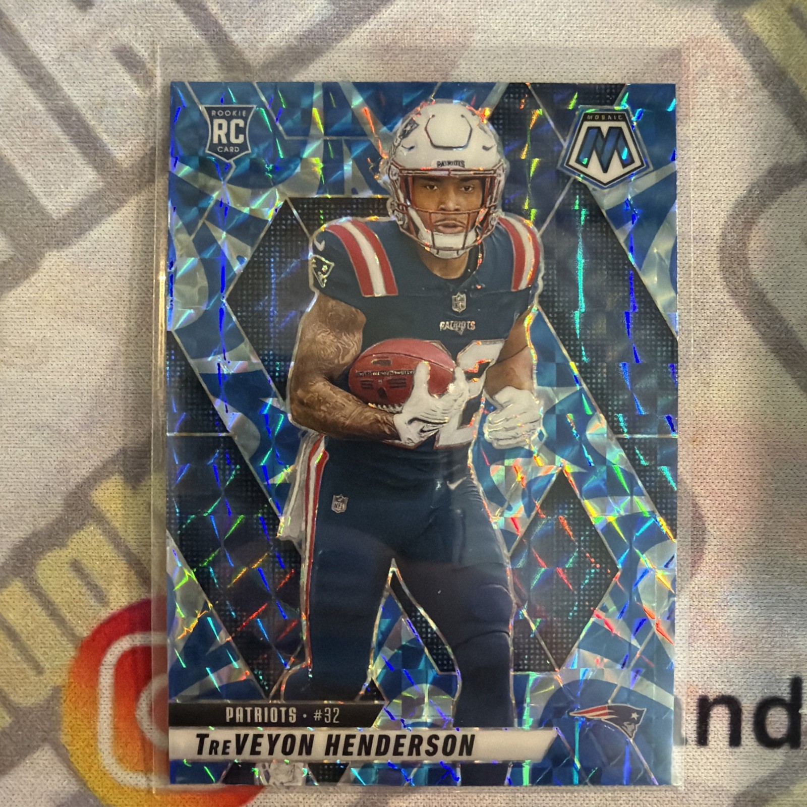 2025 Panini Mosaic - Rookies TreVeyon Henderson #325 Reactive Blue Mosaic Prizm
