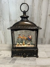 12" Melrose Christmas Bronze LED Lantern Santa w/ Reindeer Swirling Snow Globe