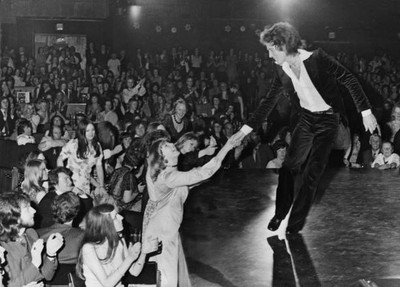 Singer Gilbert O'Sullivan wearing a velvet suit flirts a member of- Old Photo