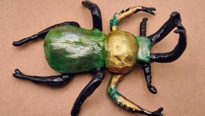 Hand-Sculpted Green Stag Beetle Figurine – Shimmering Exoskeleton Desk Art
