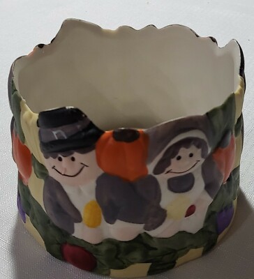 1 is of pilgrims and the other IndianHandpaint votivecandle holder/succulent pot