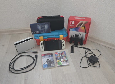 Nintendo Switch OLED weiß wie neu OVP + Super Smash Bros + AC Ezio + Cases + Fol