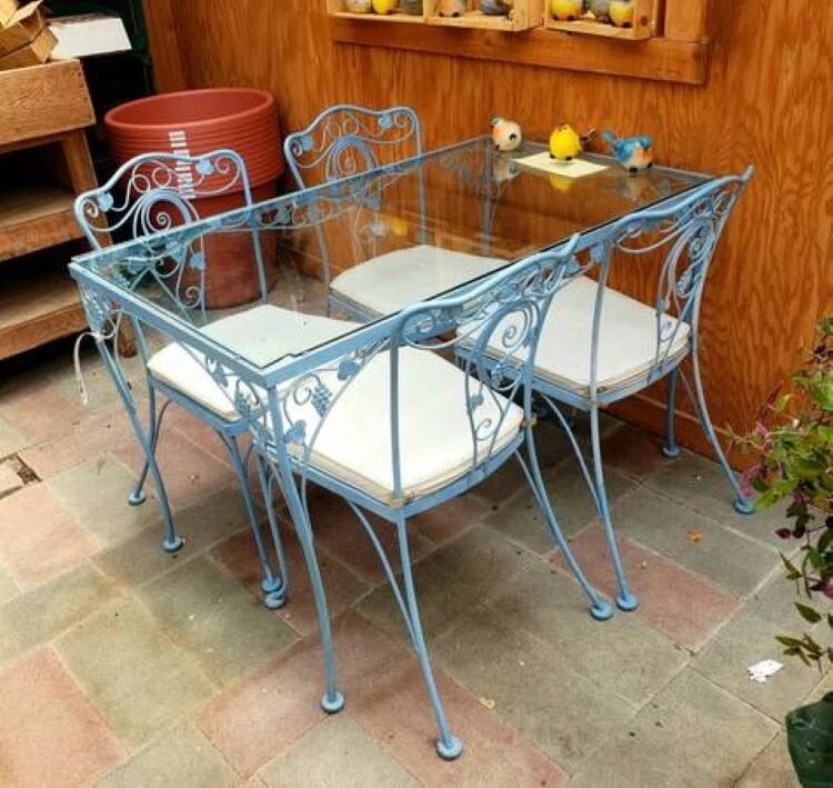 wrought iron dining room table and chairs