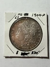 1904 Silver Dollar nice golden toning!