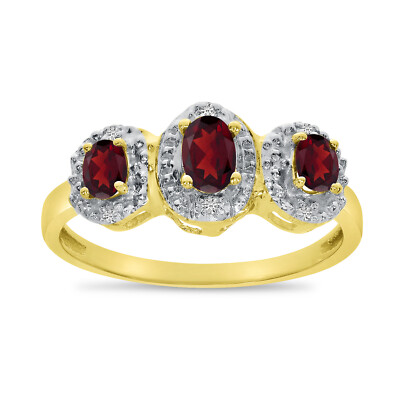 Ring 10 Karat Gelbgold ovaler Granat und Diamant mit drei Steinen