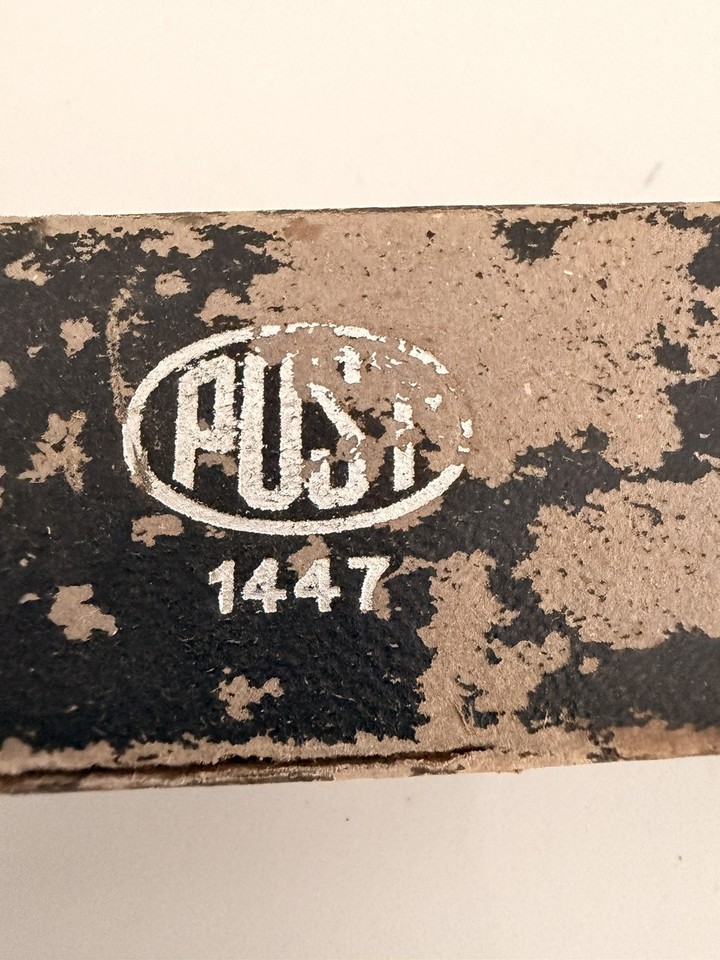 A bamboo slide rule made in Occupied Japan — the 'Occupied Japan' mark alone makes it a historically loaded collectible, and the bamboo construction is genuinely rare.