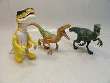 Three Jurassic World Dinosaur Figure one has lights and sound