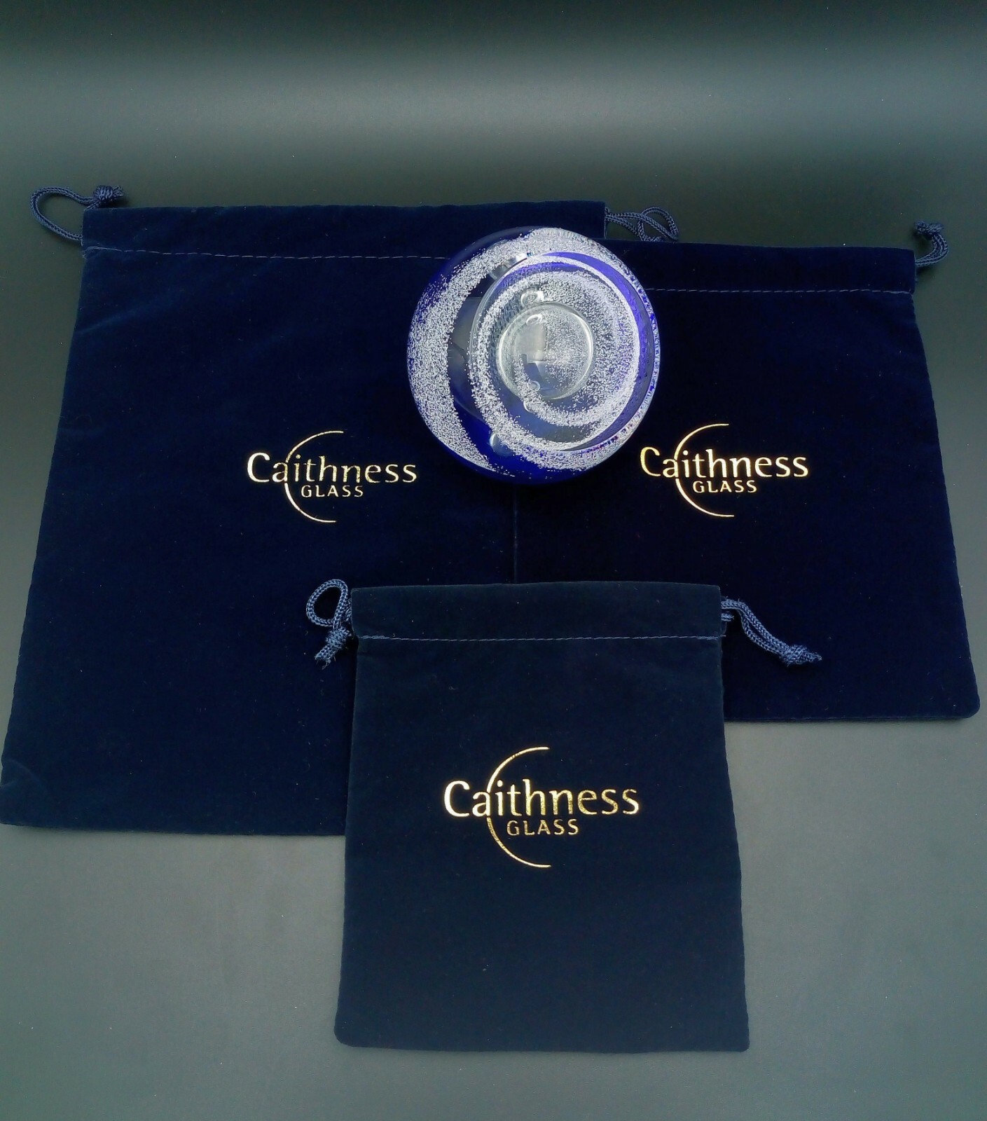 A selection of Caithness paperweight retail display stands & velvet gift pouches eBay
