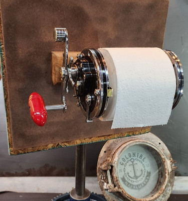 Deep Sea Penn Fishing Reel Toilet Paper Holder - It works! Repurposed ...