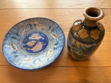 Antique Qajar dish and an antique Qajar vase, both colourfully hand decorated