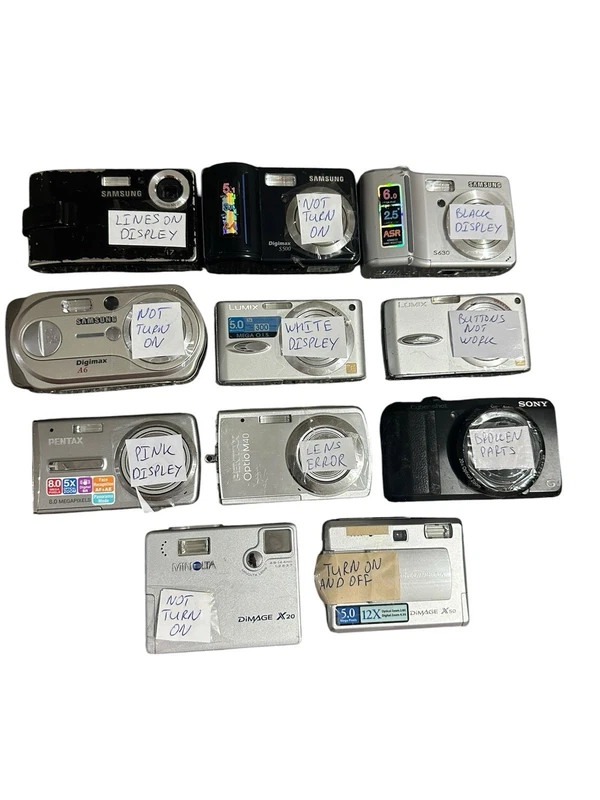 lot of eleven digital cameras from Samsung, Sony, Panasonic and Pentax for parts
