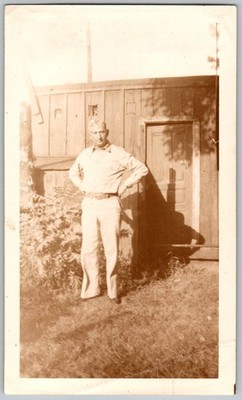 Vtg B&W Snapshot Man Hands On Hips Standing IN Front Of Rustic Wood Shed 1940s