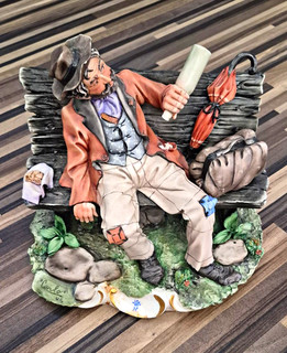 CAPODIMONTE Bisque Figurine Drunk Man On Bench