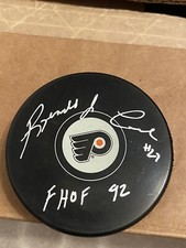 REGGIE LEACH AUTOGRAPHED FLYERS PUCK SIGNED REGINALD W/COA FHOF 92 INSCRIPTION