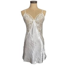 Silky white slip with sheer lace detailing and adjustable straps