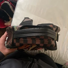 Brown and orange tyreek hill sprayground very good condition