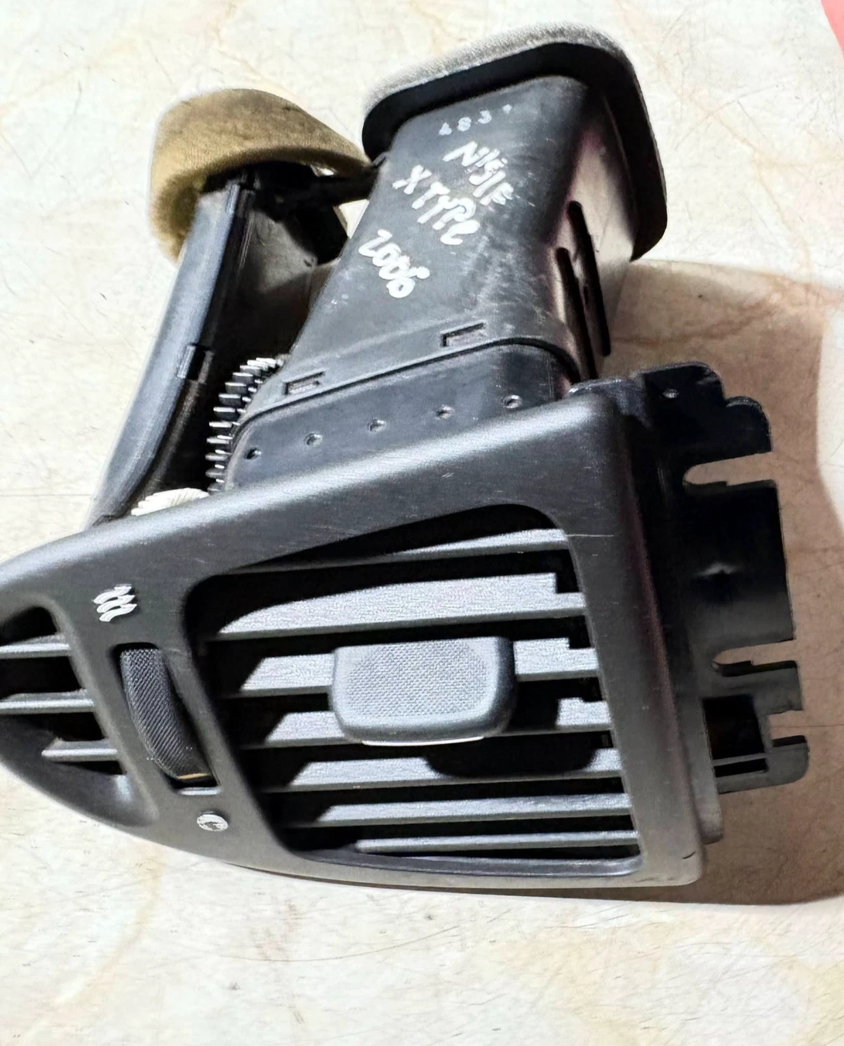 Actual Jaguar X-Type passenger left outer dashboard air vent - front view
