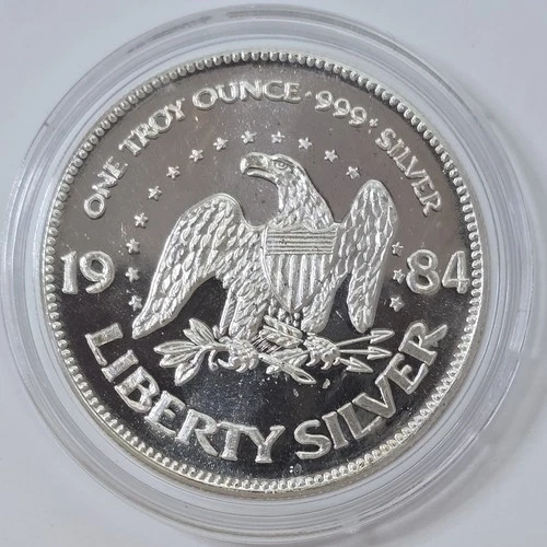 1984 1oz .999 Silver Life Liberty Happiness A-Mark Round UNC in a Capsule
