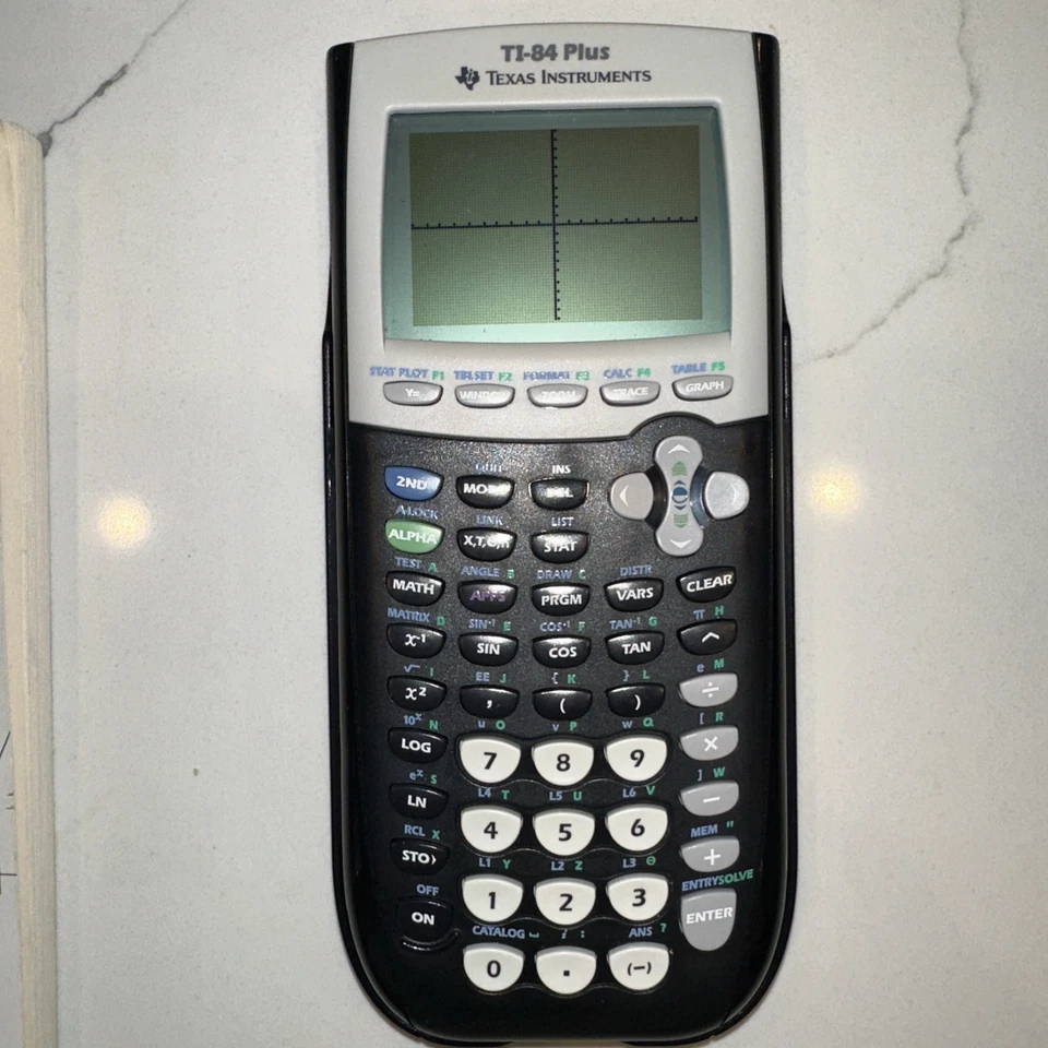 Calculadora gráfica Texas Instruments Ti-84 Plus edición plateada con guía Foto 3 de 4