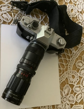 Yashica TL Super with 4 lenses, camera case, and flash